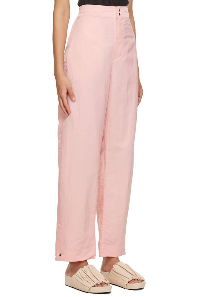 Wide-leg crinkled nylon taffeta trousers. Water-repellent, stain-resistant, and wrinkle-resistant. 

· Partially elasticized waistband
· Four-pocket styling
· Zip-fly
· Press-stud vent at cuffs 

Supplier color: Baby pink