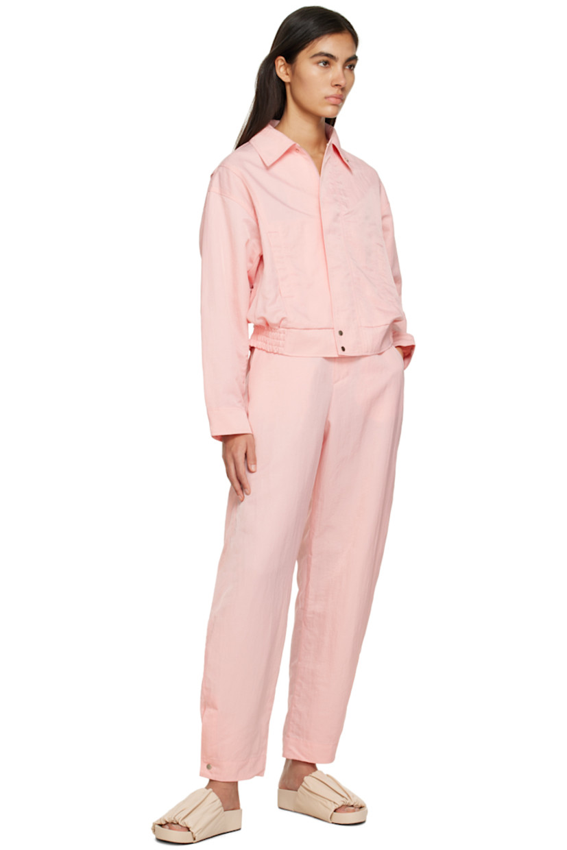 Wide-leg crinkled nylon taffeta trousers. Water-repellent, stain-resistant, and wrinkle-resistant. 

· Partially elasticized waistband
· Four-pocket styling
· Zip-fly
· Press-stud vent at cuffs 

Supplier color: Baby pink