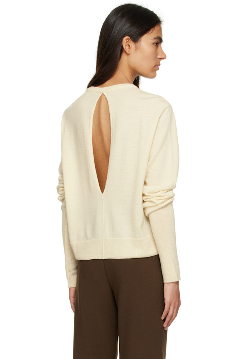 Knit wool sweater. 

· Rib knit V-neck, hem, and cuffs
· Pinched seams at front
· Cutout at back 

Supplier color: Ivory