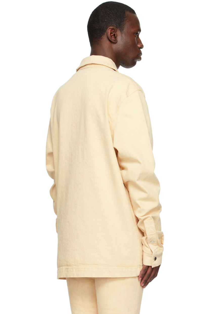 Stretch denim shirt.

· Spread collar
· Press-stud closure
· Logo hardware at chest
· Patch pockets
· Single-button barrel cuffs
· Logo-engraved silver-tone hardware

Supplier color: Oatmeal