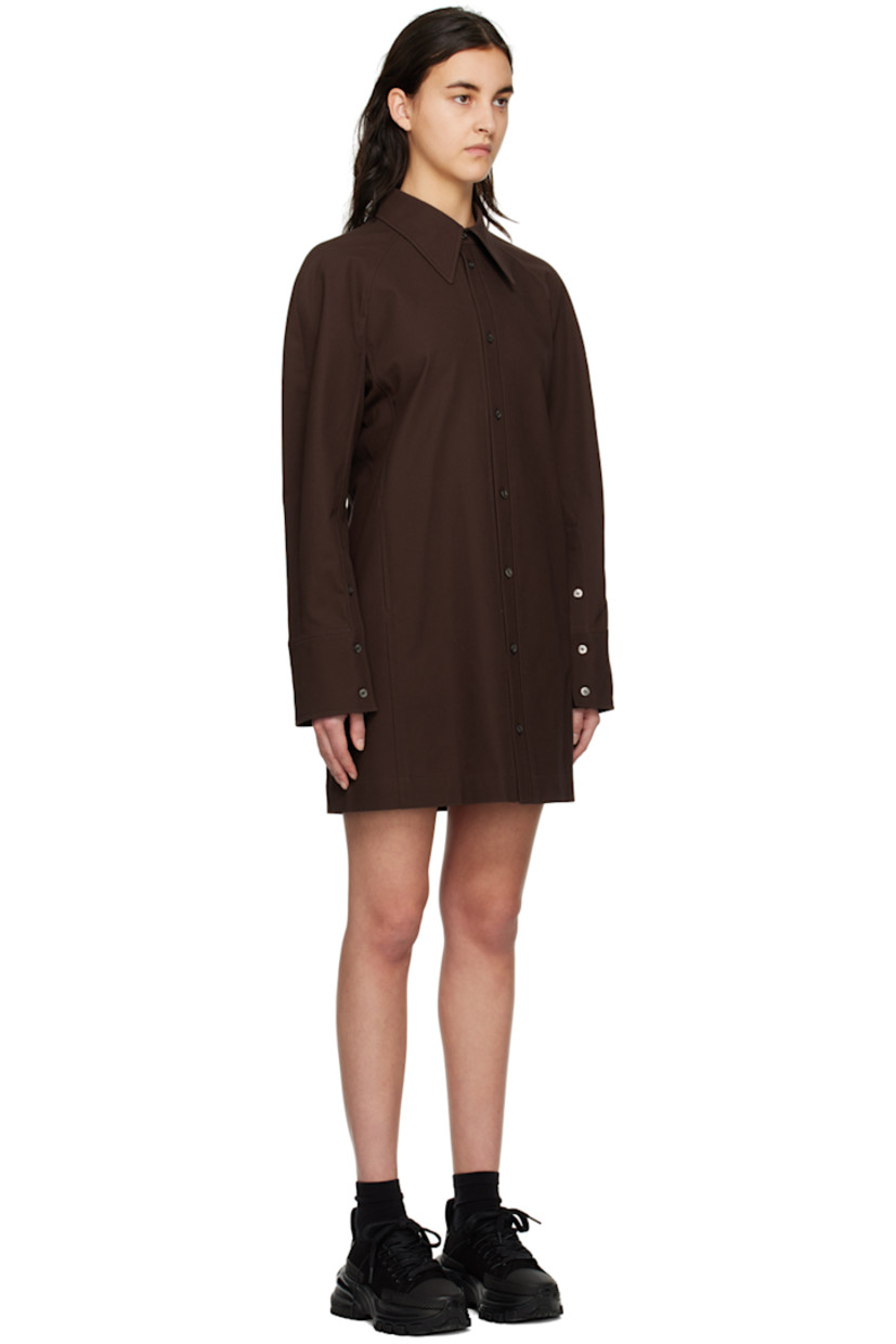 Cotton twill dress.

· Spread collar
· Button closure
· Seam pockets
· Raglan sleeves
· Single-button barrel cuffs
· Logo hardware at back collar
· Storm flap at back
· Unlined

Supplier color: Mud
