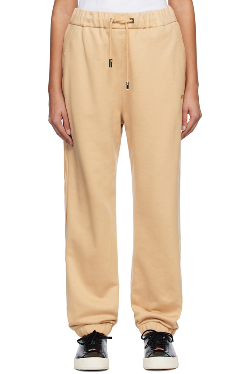 French terry lounge pants.

· Drawstring at elasticized waistband
· Four-pocket styling
· Logo embroidered at front leg
· Concealed bungee-style drawstring at elasticized cuffs
· Logo-engraved silver-tone hardware

Supplier color: Beige