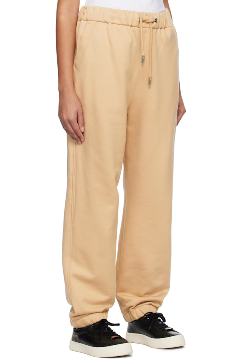 French terry lounge pants.

· Drawstring at elasticized waistband
· Four-pocket styling
· Logo embroidered at front leg
· Concealed bungee-style drawstring at elasticized cuffs
· Logo-engraved silver-tone hardware

Supplier color: Beige