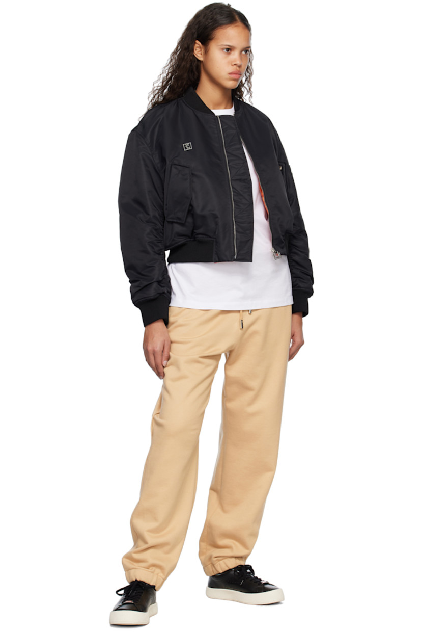 French terry lounge pants.

· Drawstring at elasticized waistband
· Four-pocket styling
· Logo embroidered at front leg
· Concealed bungee-style drawstring at elasticized cuffs
· Logo-engraved silver-tone hardware

Supplier color: Beige