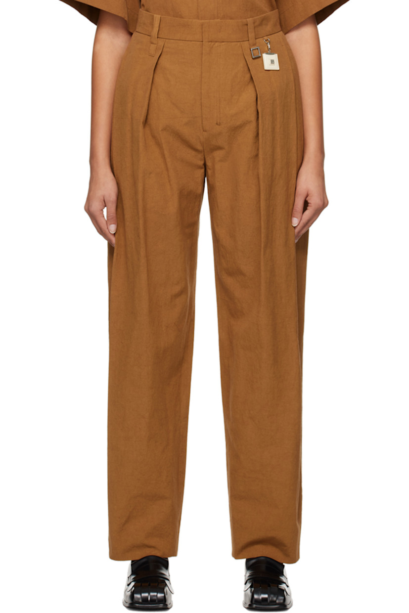 Cotton- and linen-blend poplin trousers.

· Belt loops and detachable logo charm at waistband
· Four-pocket styling
· Zip-fly
· Pleats at front
· Central creases at back

Supplier color: Camel