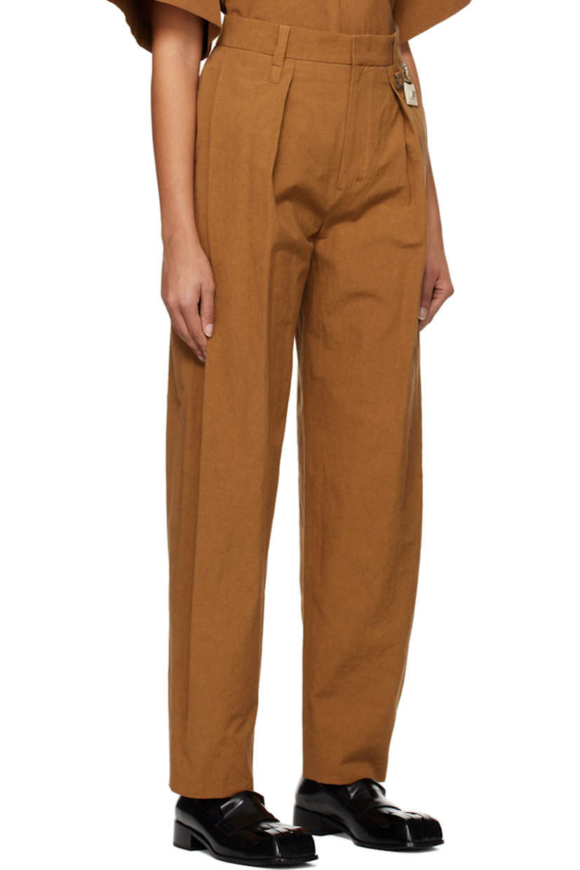 Cotton- and linen-blend poplin trousers.

· Belt loops and detachable logo charm at waistband
· Four-pocket styling
· Zip-fly
· Pleats at front
· Central creases at back

Supplier color: Camel