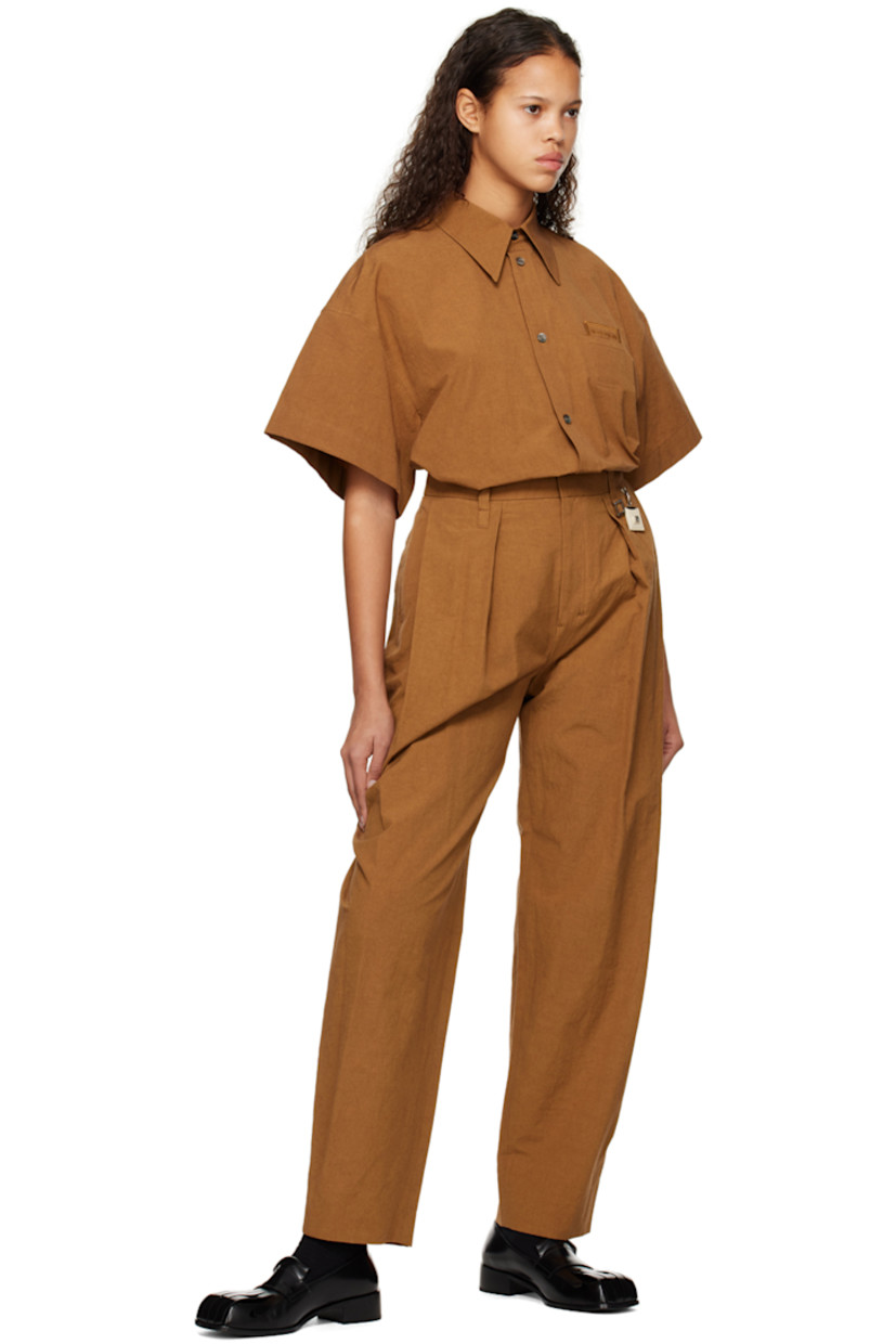 Cotton- and linen-blend poplin trousers.

· Belt loops and detachable logo charm at waistband
· Four-pocket styling
· Zip-fly
· Pleats at front
· Central creases at back

Supplier color: Camel