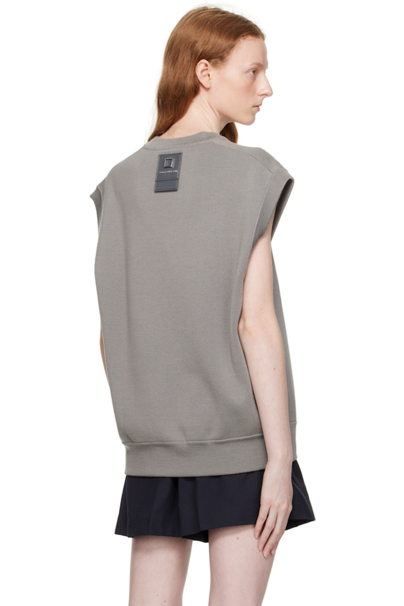 Knit wool vest.

· Rib knit V-neck, hem, and armscyes 
· Embroidered logo patch at hem 
· Leather logo patch at back collar 

Supplier color: Gray