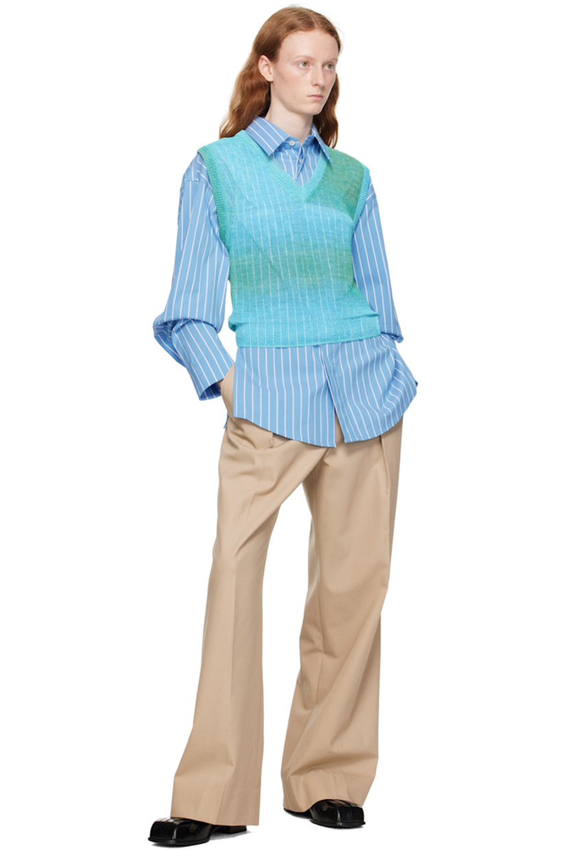 Semi-sheer knit cellulose vest. Gradient pattern throughout. 

· Rib knit V-neck, hem, and armscyes 
· Logo hardware at back collar

Supplier color: Mint
