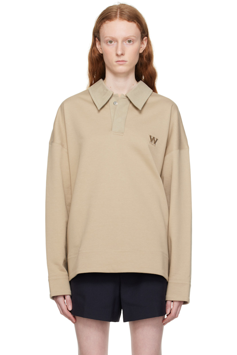 French terry polo. 

· Cotton canvas spread collar
· Two-press-stud placket
· Logo embroidered at chest 
· Vented side seams
· Logo hardware at back collar 

Supplier color: Beige