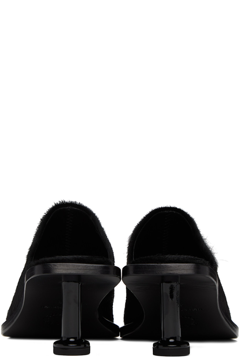 Goat hair heels in black.

· Pointed toe
· Textile logo patch at padded leather footbed
· Goodyear stitching at welt
· Pedestal kitten heel with rubber injection
· Leather outsole
· Heel: H2.5 in

Supplier color: Black