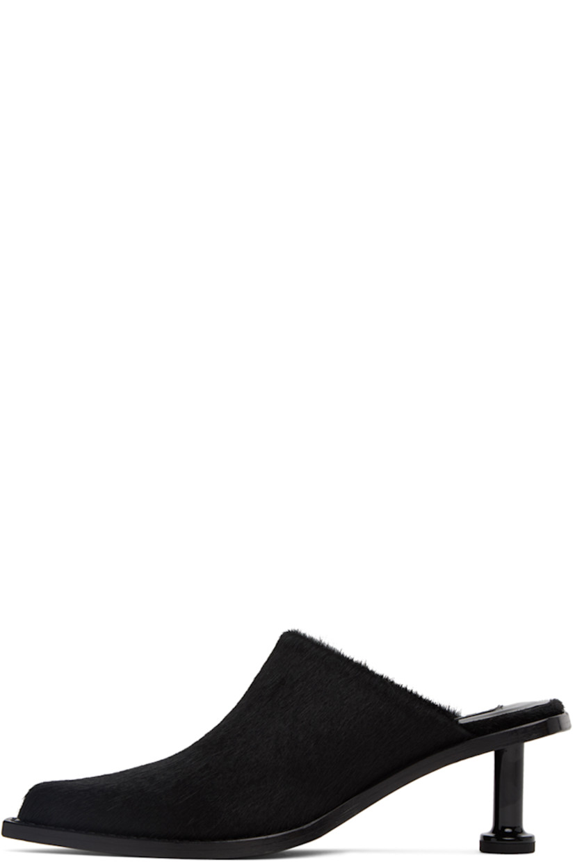 Goat hair heels in black.

· Pointed toe
· Textile logo patch at padded leather footbed
· Goodyear stitching at welt
· Pedestal kitten heel with rubber injection
· Leather outsole
· Heel: H2.5 in

Supplier color: Black