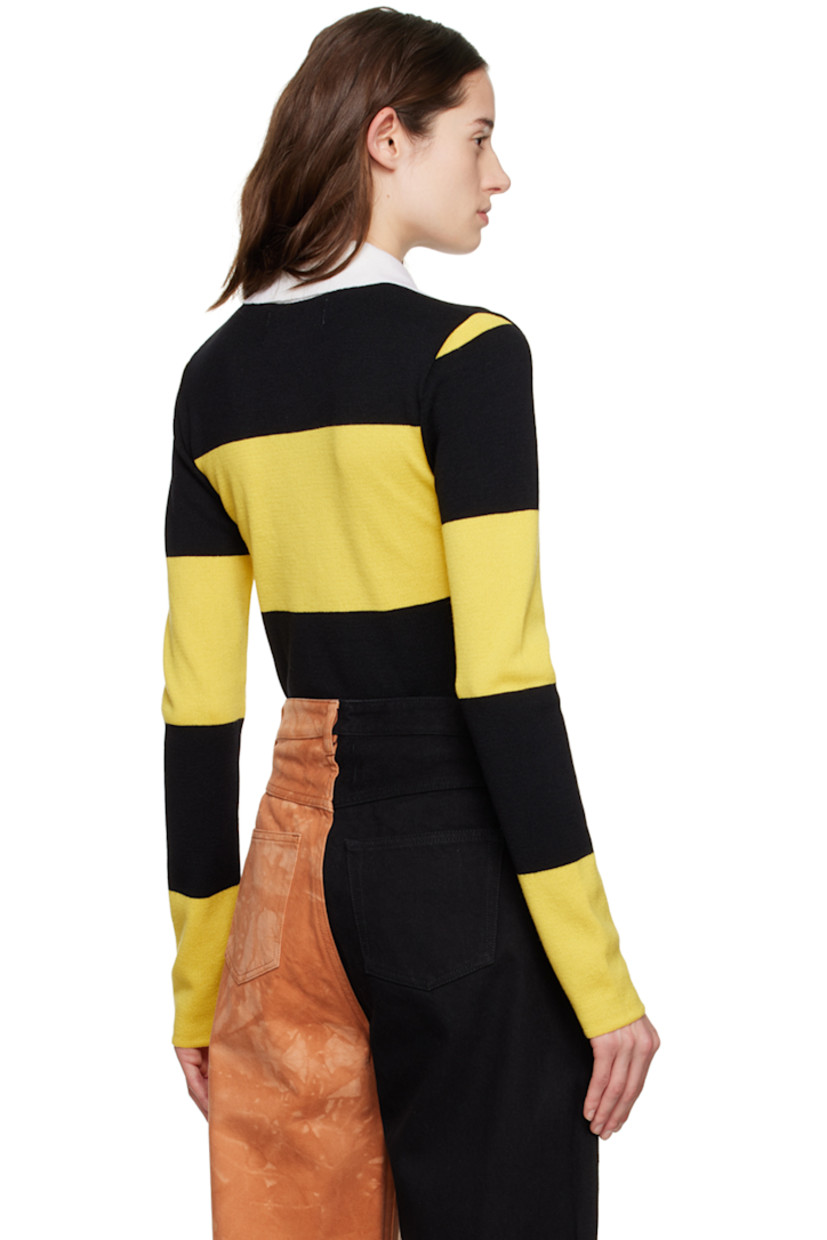 Knit merino wool polo. Stripes throughout.

· Rib knit spread collar
· Three-button placket

Supplier color: Yellow/Black