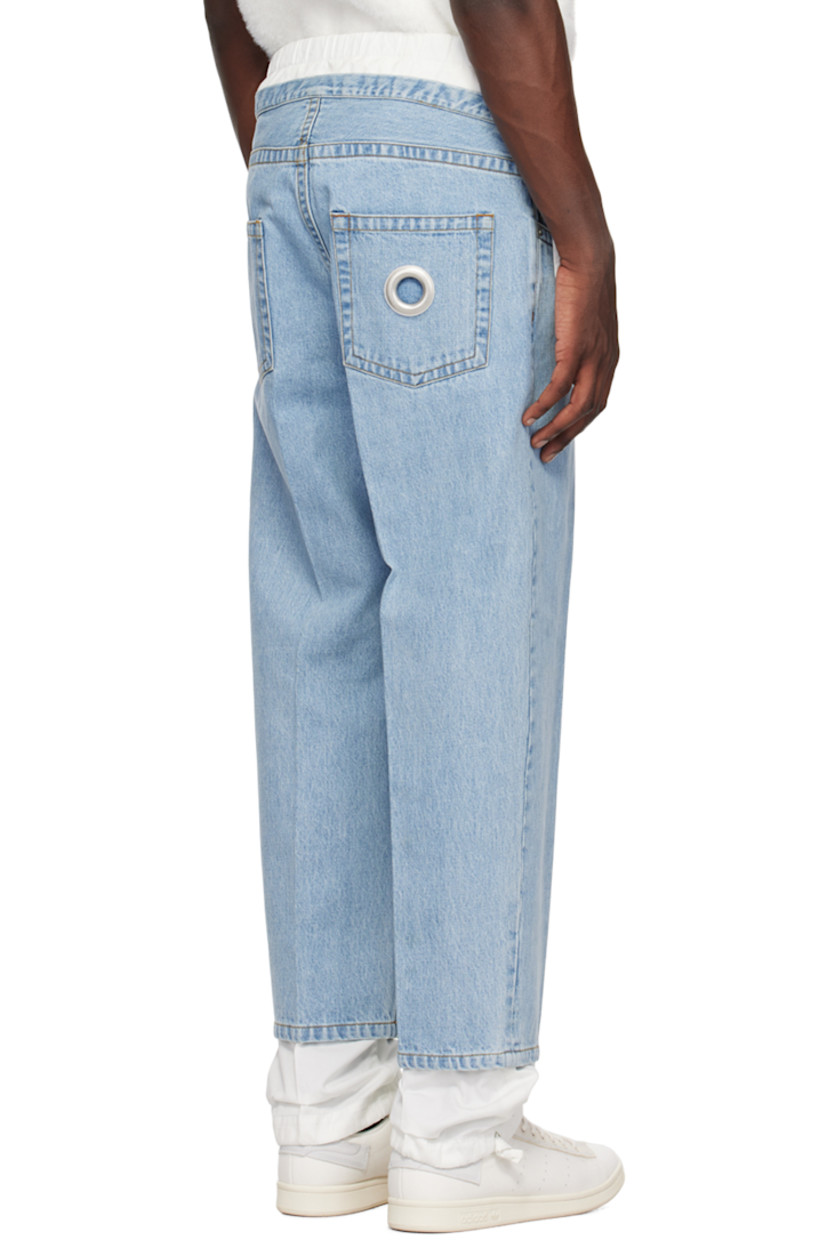 Non-stretch denim and cotton twill jeans. Fading throughout. 

· Layered construction
· Elasticized waistband
· Drawstrings at waistband and cuffs
· Five-pocket styling
· Button-fly
· Central creases at front and back
· Eyelet vent at back pocket
· Contrast stitching in tan

Supplier color: Light blue