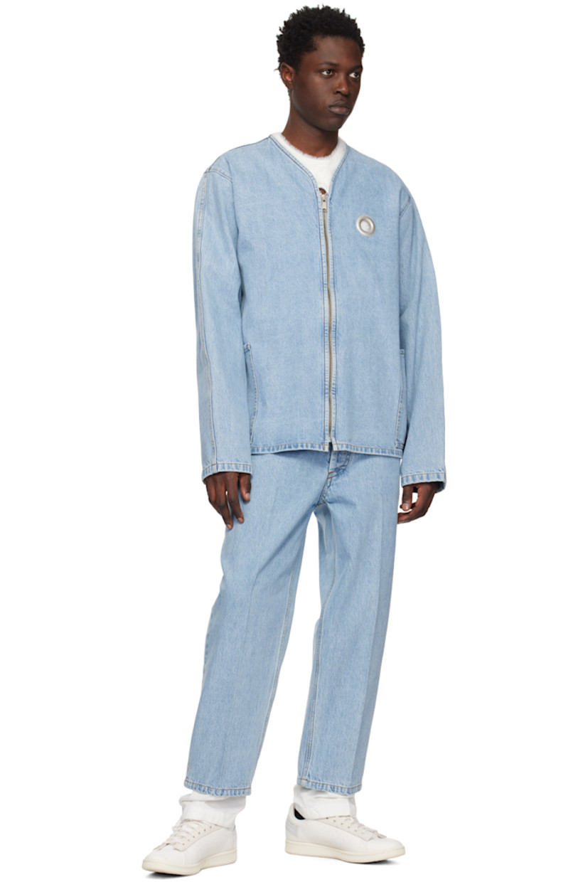Non-stretch denim and cotton twill jeans. Fading throughout. 

· Layered construction
· Elasticized waistband
· Drawstrings at waistband and cuffs
· Five-pocket styling
· Button-fly
· Central creases at front and back
· Eyelet vent at back pocket
· Contrast stitching in tan

Supplier color: Light blue