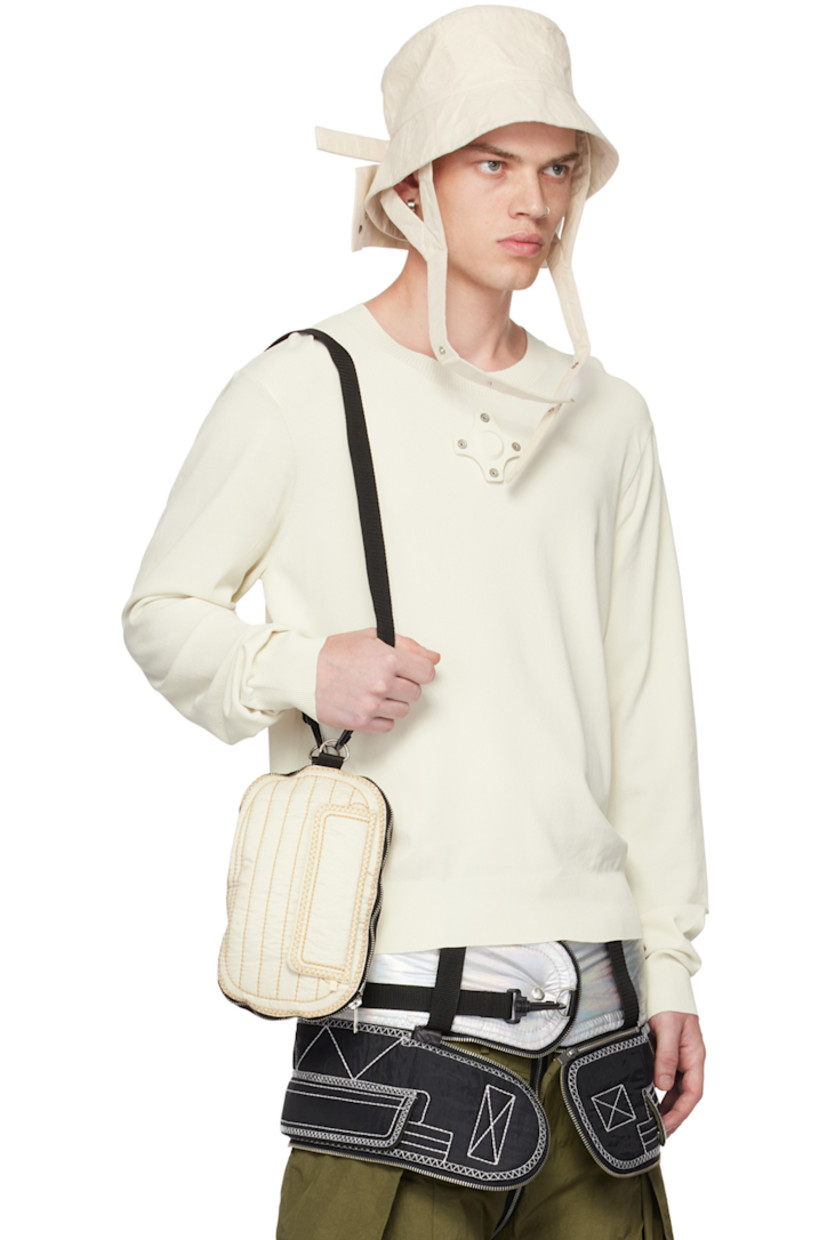Packable crinkled nylon- and cotton-blend taffeta shirt. 

· Press-stud tab at spread collar
· Zip closure
· Zip pockets
· Detachable webbing strap at front and back 
· Shirttail hem
· Press-stud fastening at cuffs

Supplier color: Cream