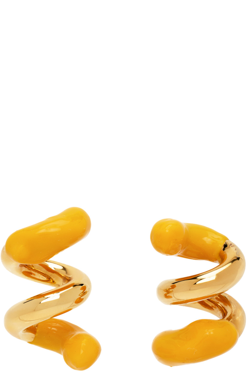 Pair of drop earrings in gold-tone brass. Twisted detailing throughout.

· Hand-rubberized accent in yellow at length
· Logo etched at side
· Post-stud fastening 
· H1.5" x W1"

Supplier color: Gold/Apricot