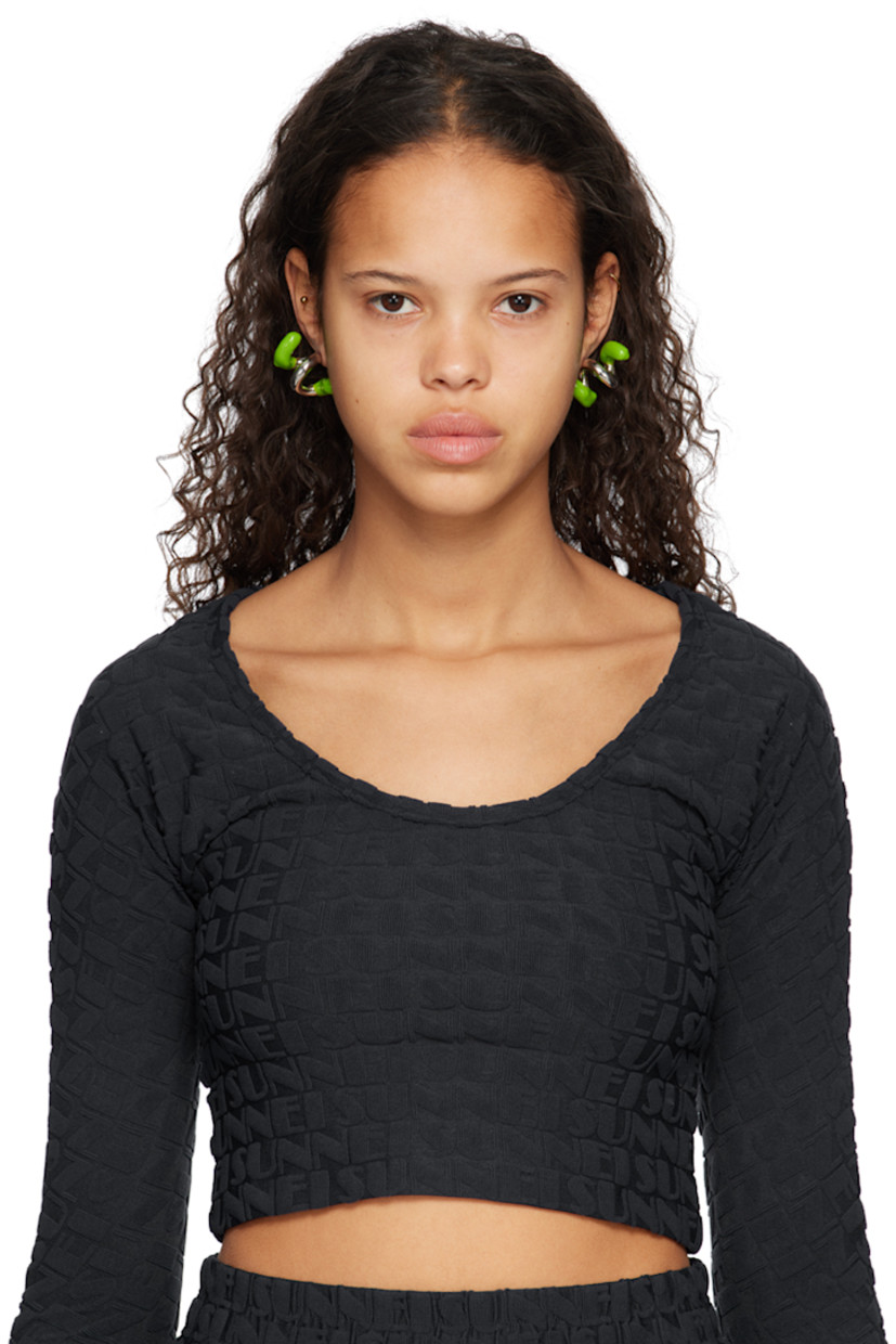 Pair of drop earrings in silver-tone brass. Twisted detailing throughout.

· Hand-rubberized accent in green at length
· Logo etched at side
· Post-stud fastening 
· H1.5" x W1"

Supplier color: Silver/Fern green