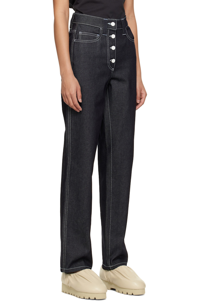 Non-stretch denim jeans.

· Belt loops
· Five-pocket styling
· Button-fly
· Rubberized logo patch at back waistband
· Logo-engraved white hardware
· Contrast stitching in white

Supplier color: Dark denim