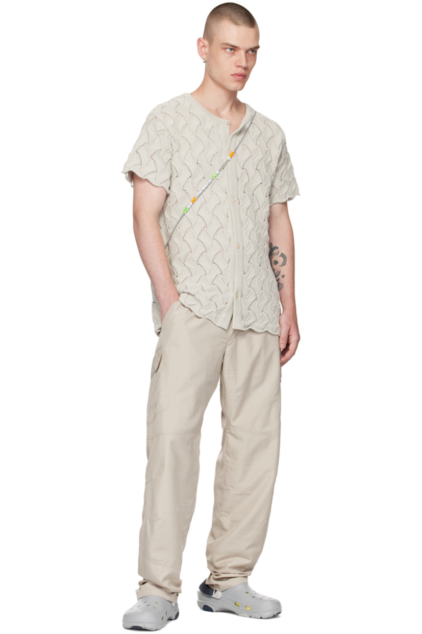 Relaxed-fit recycled polyester ripstop cargo pants. 

· Elasticized waistband 
· Two-pocket styling 
· Mock-fly 
· Darts at knees 
· Logo embroidered at outseam 
· Cargo pocket at outseams 
· Full mesh lining 

Supplier color: Grey