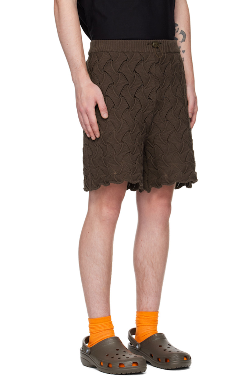 Textured knit cotton shorts. Jacquard graphic pattern throughout. 

· Bungee-style drawstring at elasticized waistband 
· Rolled cuffs 

Supplier color: Brown