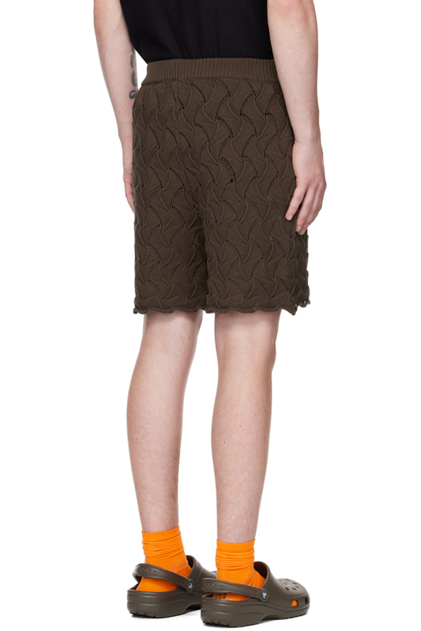 Textured knit cotton shorts. Jacquard graphic pattern throughout. 

· Bungee-style drawstring at elasticized waistband 
· Rolled cuffs 

Supplier color: Brown