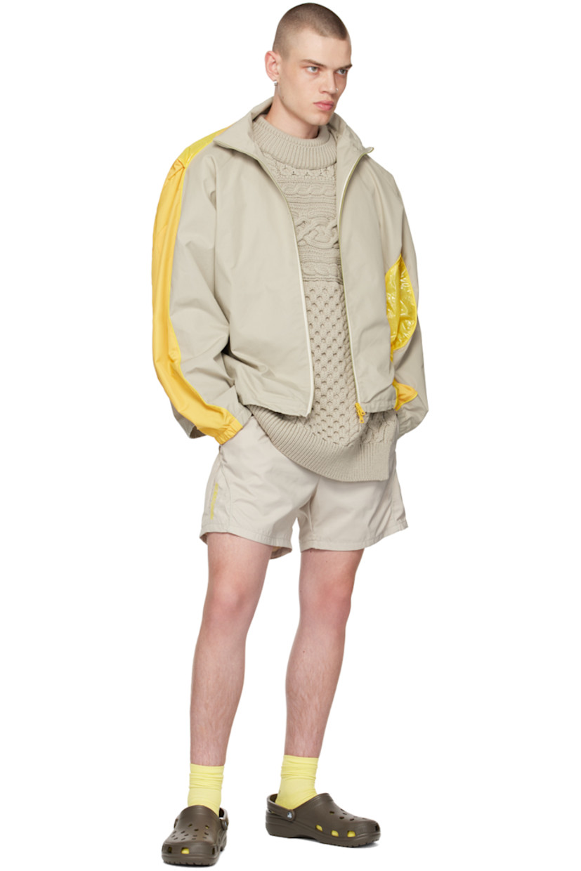Aran knit merino wool vest. 

· Rib knit layered crewneck, hem, and armscyes
· Open side seams

Supplier color: Grey