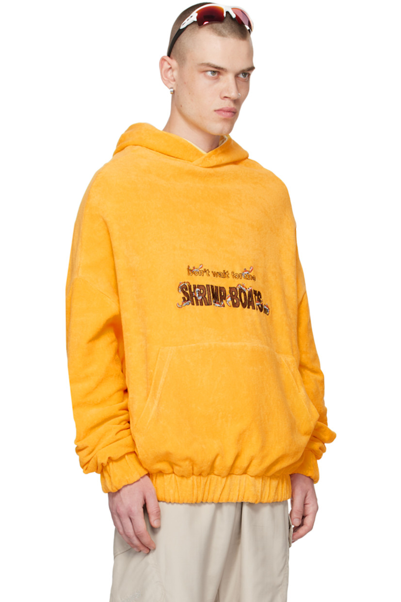 Reverse French terry hoodie. 

Reverse in yellow cotton jersey. 

· Text and graphic embroidered at front and back
· Kangaroo pocket 
· Elasticized hem and cuffs 
· Dropped shoulders 
· Kangaroo pocket at interior 

Supplier color: Yellow
