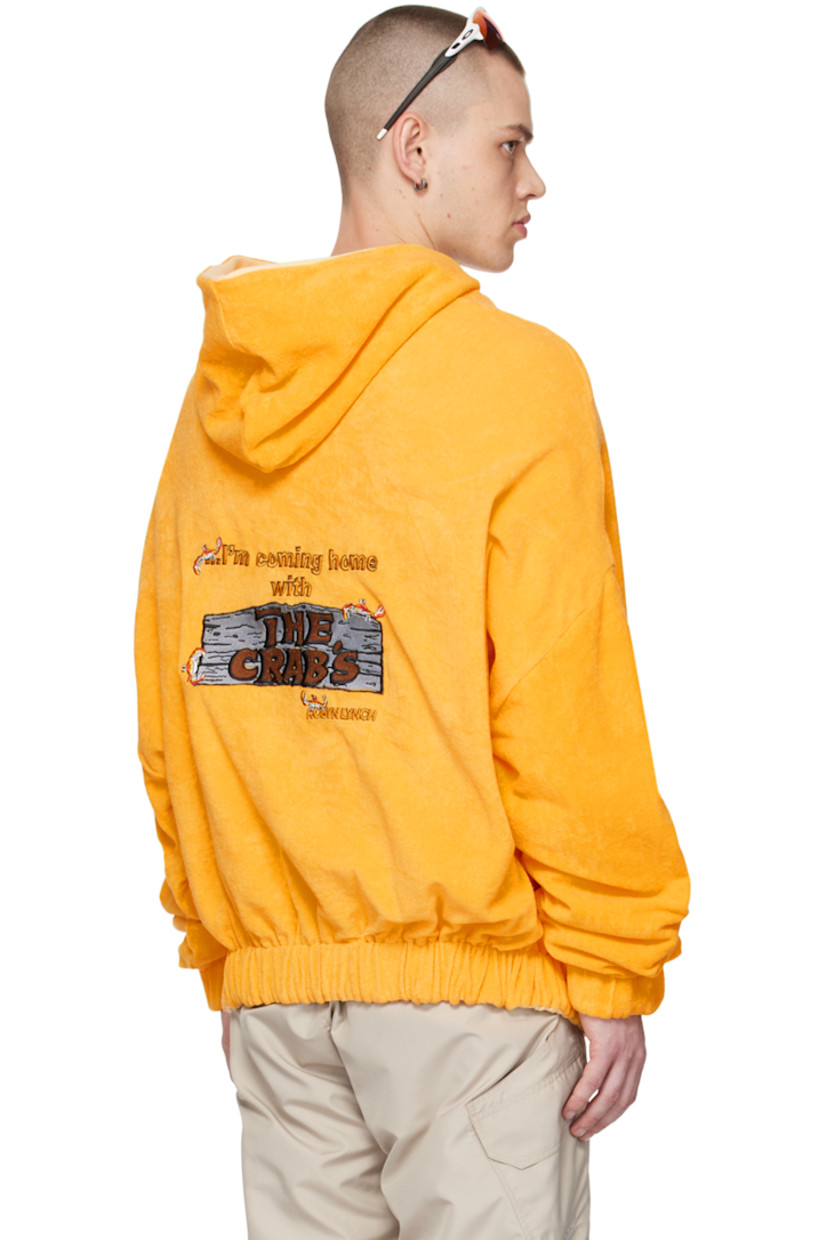Reverse French terry hoodie. 

Reverse in yellow cotton jersey. 

· Text and graphic embroidered at front and back
· Kangaroo pocket 
· Elasticized hem and cuffs 
· Dropped shoulders 
· Kangaroo pocket at interior 

Supplier color: Yellow