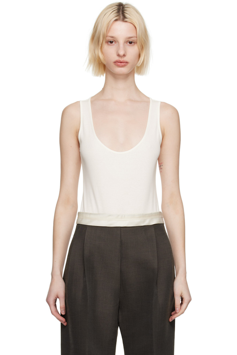 Rib knit cotton bodysuit.

· Scoop neck
· Press-stud closure at bottom

Supplier color: Cream