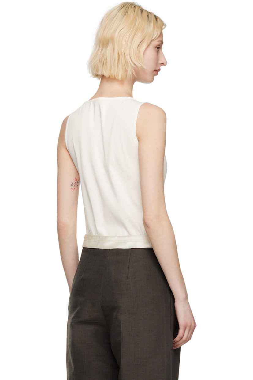 Rib knit cotton bodysuit.

· Scoop neck
· Press-stud closure at bottom

Supplier color: Cream