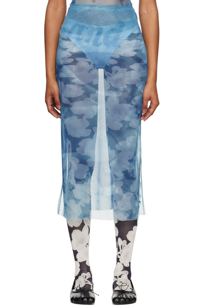 Lightweight semi-sheer stretch recycled polyester mesh skirt. Graphic and text printed throughout. 

· Elasticized waistband
· Vented side seam

Supplier color: Print multi