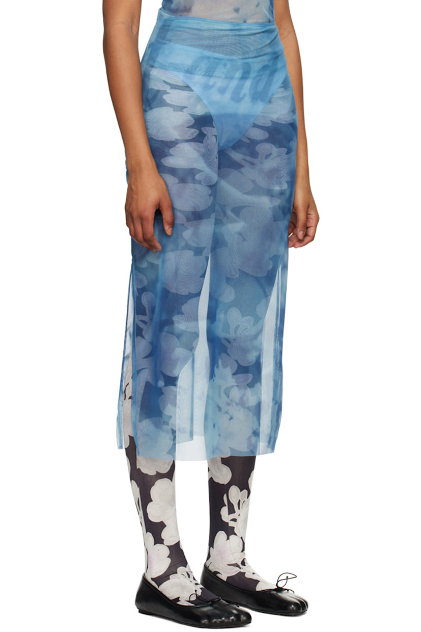 Lightweight semi-sheer stretch recycled polyester mesh skirt. Graphic and text printed throughout. 

· Elasticized waistband
· Vented side seam

Supplier color: Print multi