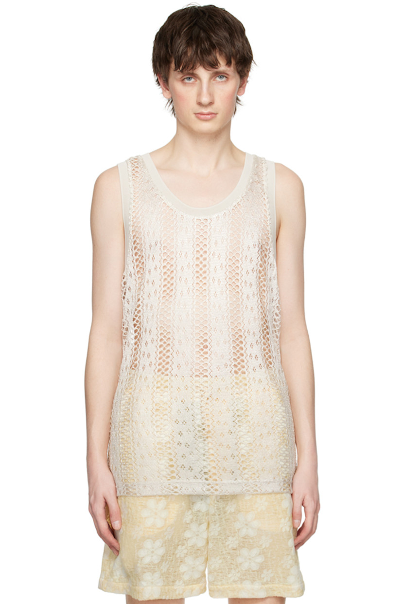 Open knit and pointelle knit polyester tank top. Rib knit scoop neck and armscyes.

Supplier color: White