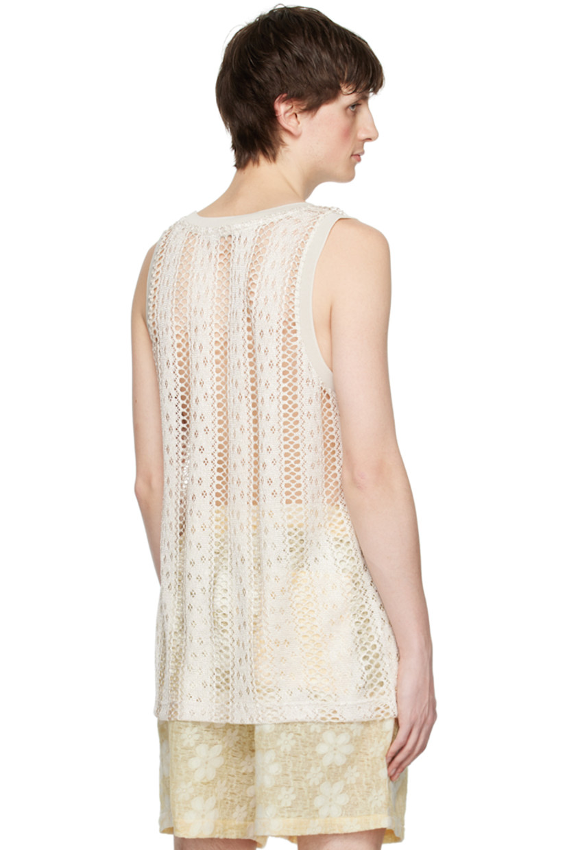 Open knit and pointelle knit polyester tank top. Rib knit scoop neck and armscyes.

Supplier color: White