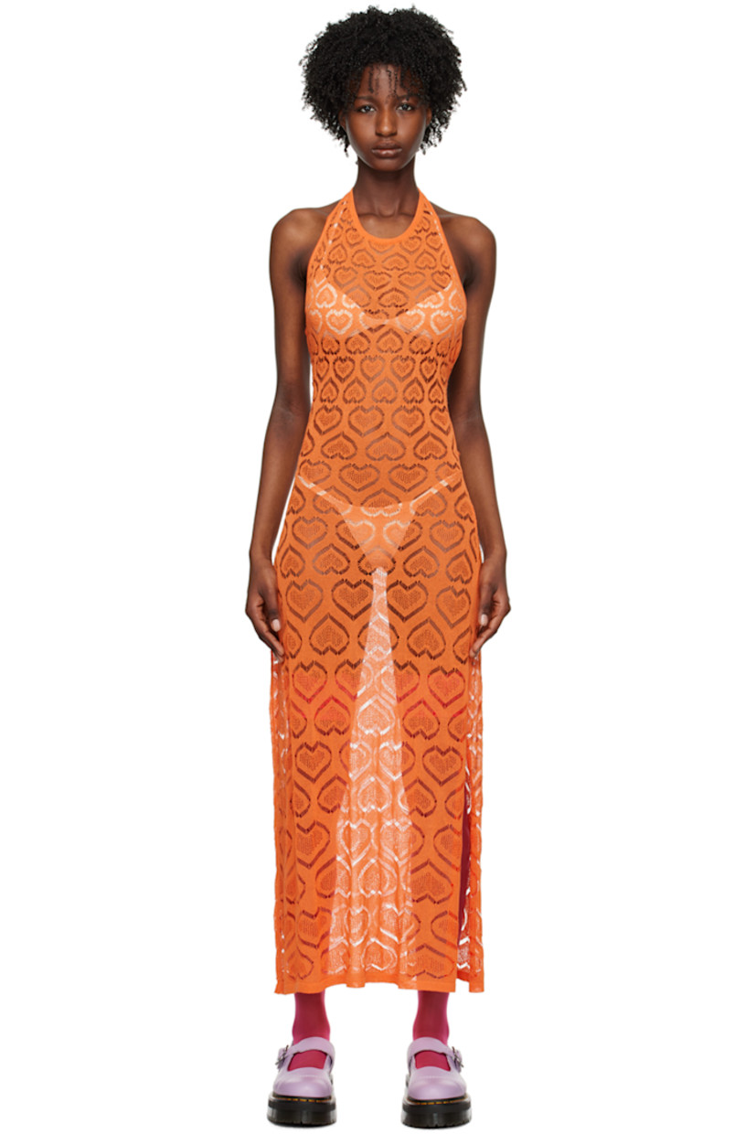 Semi-sheer raschel knit viscose-blend dress. Graphic pattern throughout.

· Rib knit scoop neck and hem
· Vented side seam
· Self-tie halter strap
· Self-tie fastenings at open back

Available exclusively at SSENSE. 

Supplier color: Orange