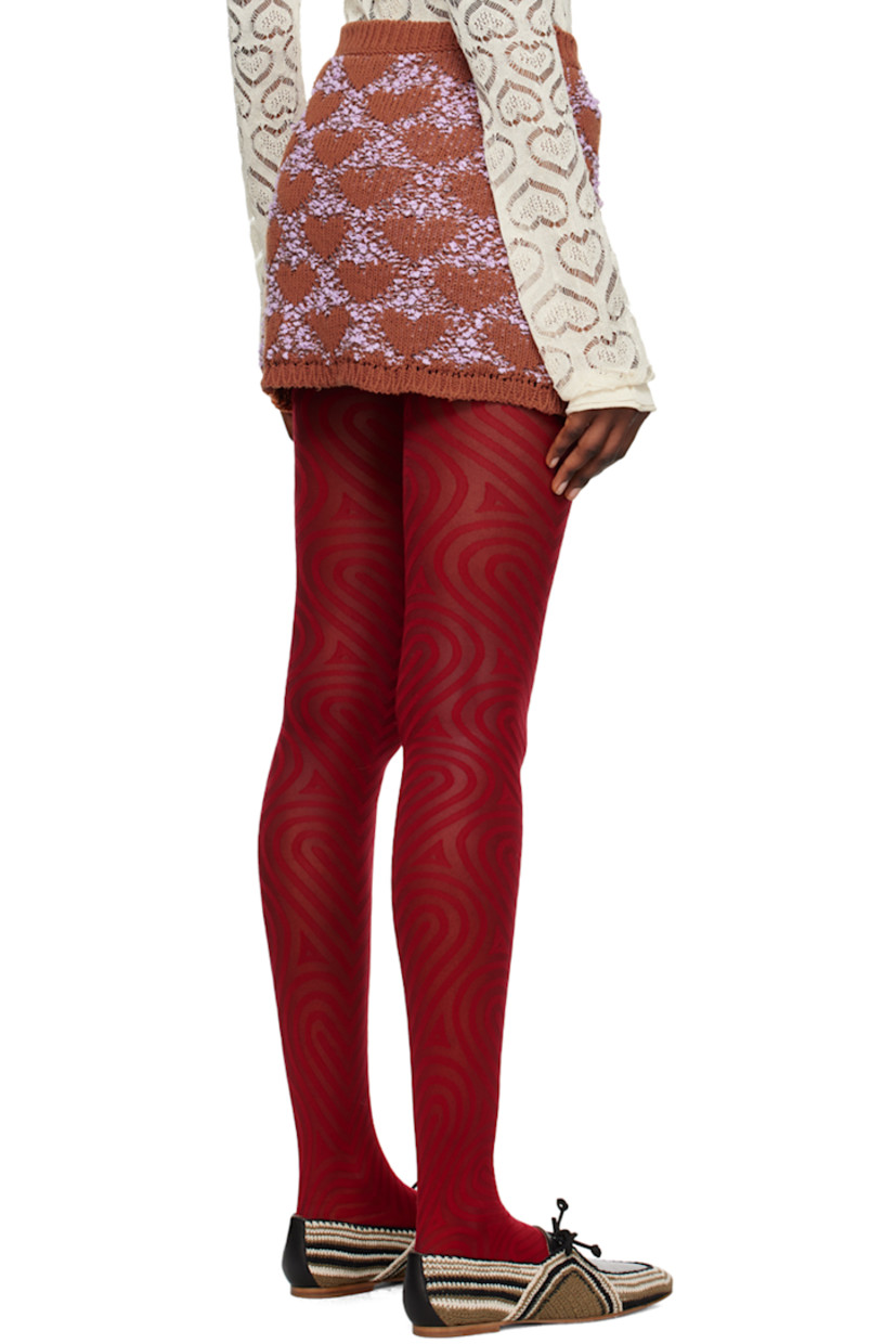 Knit cotton-blend skirt. Jacquard bouclé pattern throughout. 

· Rib knit waistband and hem
· Offset button closure 
· Vent at front hem

Supplier color: Brown/Liliac
