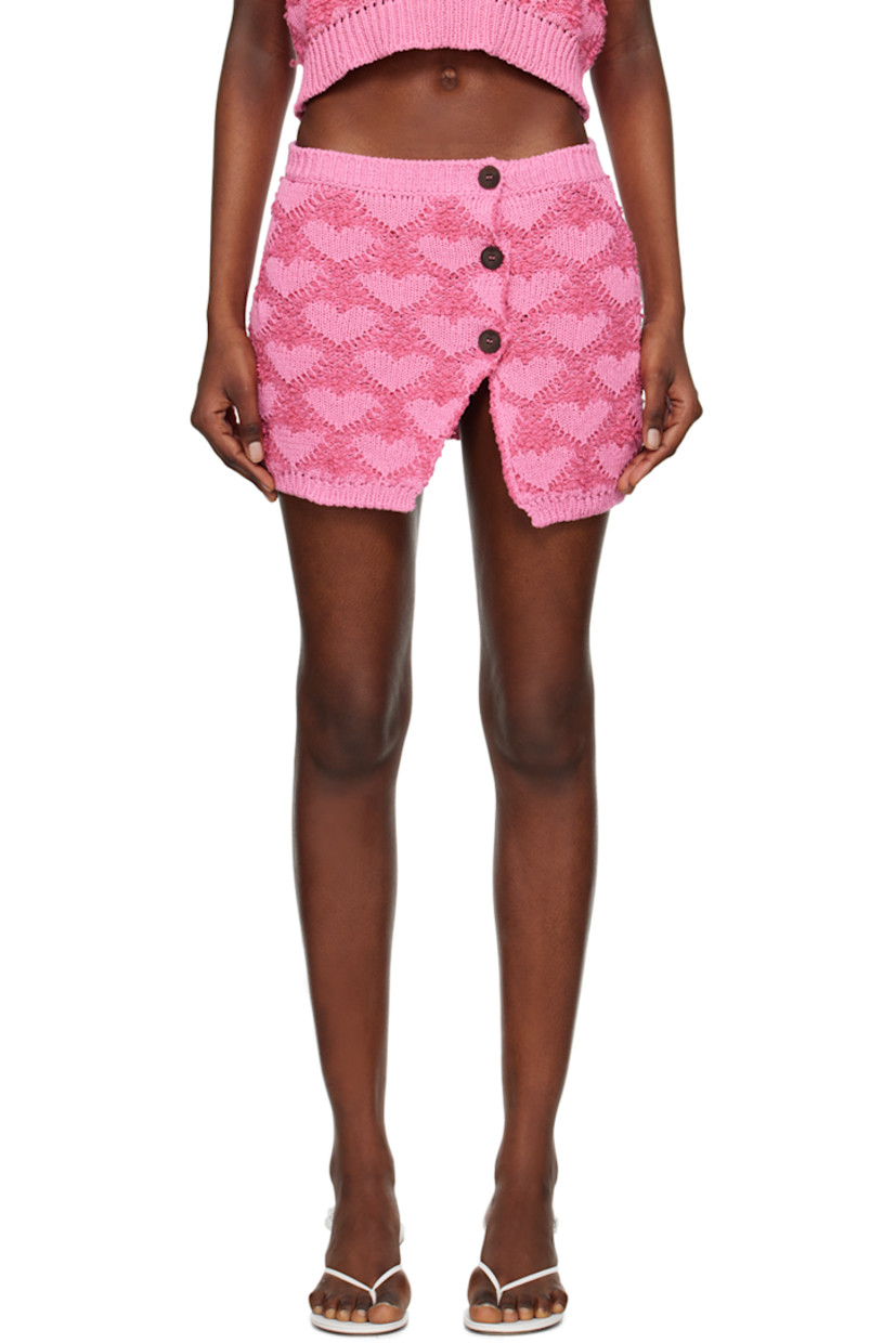 Knit cotton- and linen-blend skirt. Jacquard bouclé pattern throughout. 

· Rib knit waistband and hem
· Offset button closure
· Vent at front hem

Supplier color: Fuchsia/Pink