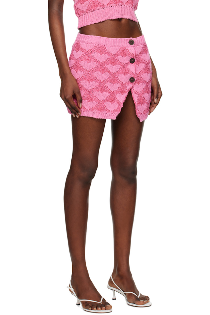 Knit cotton- and linen-blend skirt. Jacquard bouclé pattern throughout. 

· Rib knit waistband and hem
· Offset button closure
· Vent at front hem

Supplier color: Fuchsia/Pink