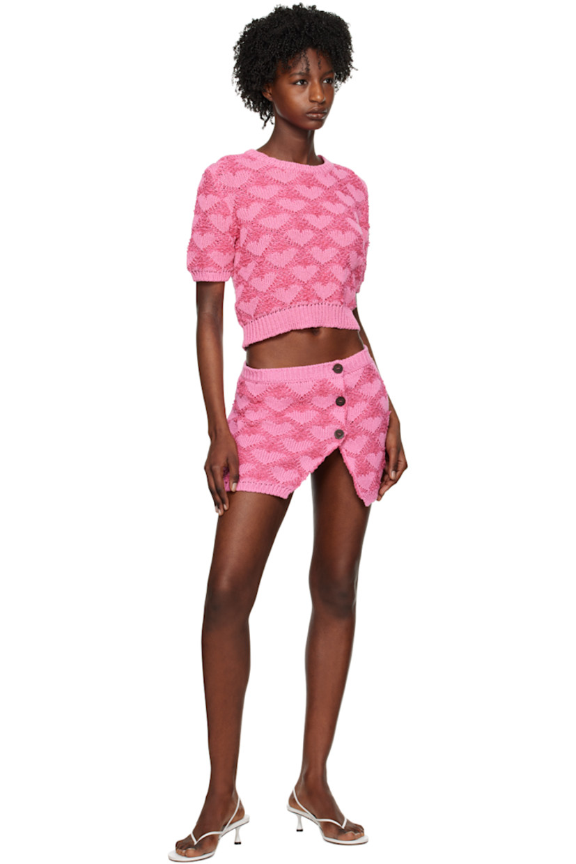 Knit cotton- and linen-blend skirt. Jacquard bouclé pattern throughout. 

· Rib knit waistband and hem
· Offset button closure
· Vent at front hem

Supplier color: Fuchsia/Pink
