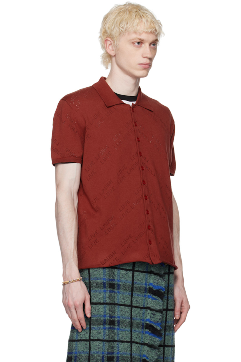 Cotton jersey shirt. Text perforated throughout.

· Spread collar
· Button closure
· Rolled edge at hem
· Rib knit cuffs

Supplier color: Youwie jersey porto