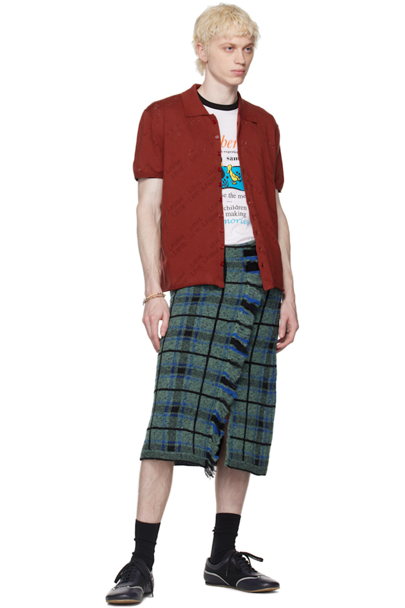 Cotton jersey shirt. Text perforated throughout.

· Spread collar
· Button closure
· Rolled edge at hem
· Rib knit cuffs

Supplier color: Youwie jersey porto