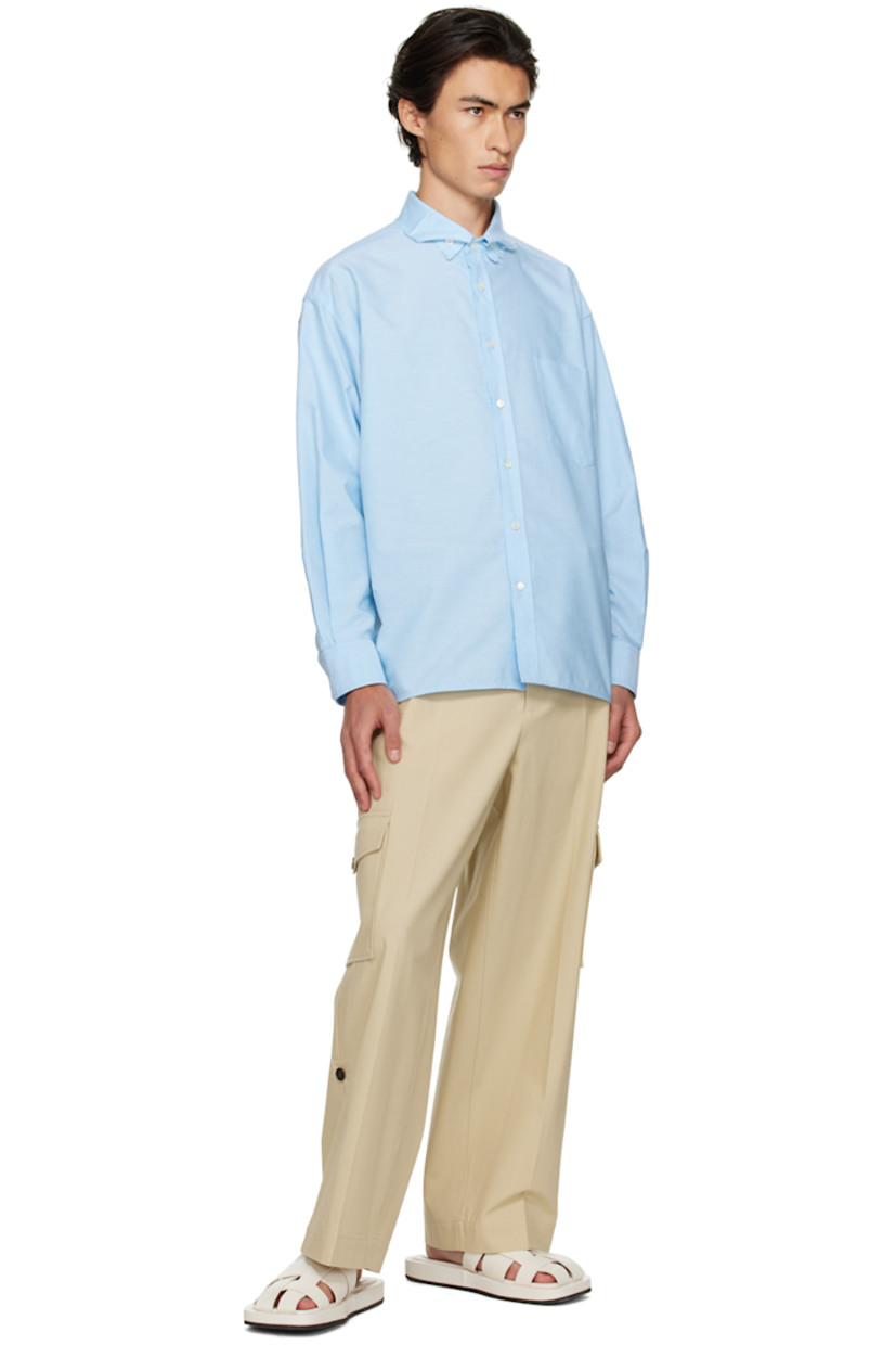 Cotton canvas cargo pants. 

· Belt loops
· Three-pocket styling
· Zip-fly 
· Central crease at front 
· Cargo pockets at outseams
· Corozo hardware

Supplier color: Light beige