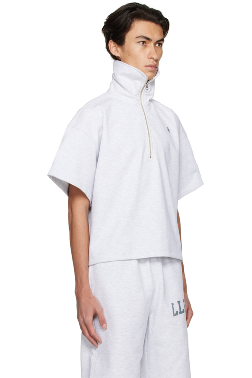French terry polo.

· Funnel neck
· Half-zip closure
· Logo embroidered at chest 

Available exclusively at SSENSE.

Supplier color: Grey