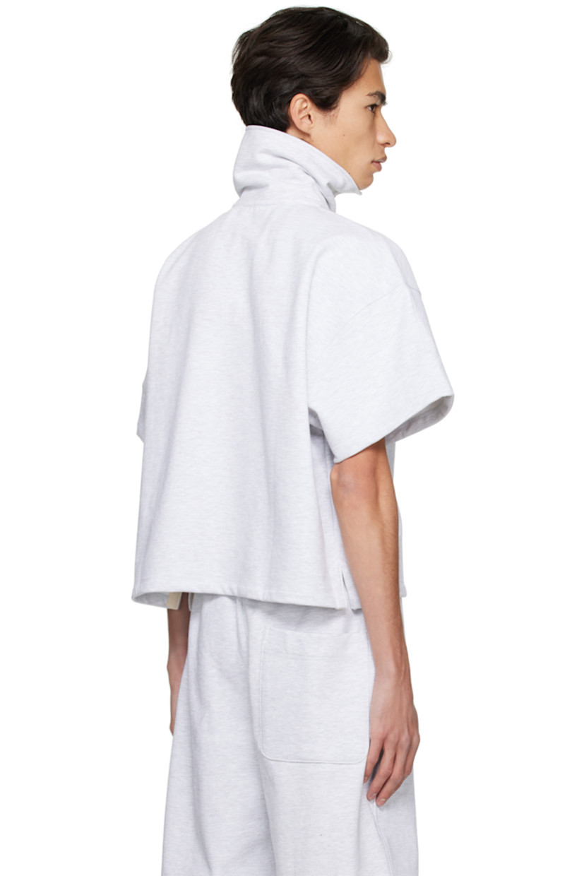 French terry polo.

· Funnel neck
· Half-zip closure
· Logo embroidered at chest 

Available exclusively at SSENSE.

Supplier color: Grey