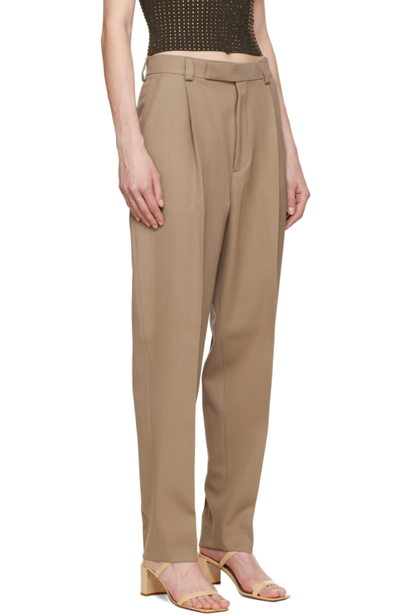 Wool gabardine trousers.

· High-rise
· Belt loops
· Three-pocket styling
· Zip-fly
· Twin pleats at front and back

Available exclusively at SSENSE.

Supplier color: Beige