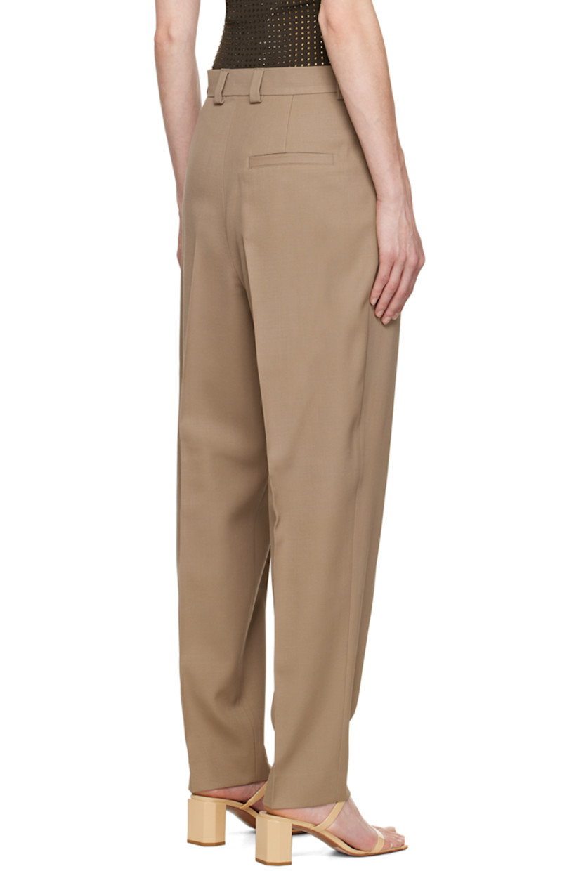Wool gabardine trousers.

· High-rise
· Belt loops
· Three-pocket styling
· Zip-fly
· Twin pleats at front and back

Available exclusively at SSENSE.

Supplier color: Beige