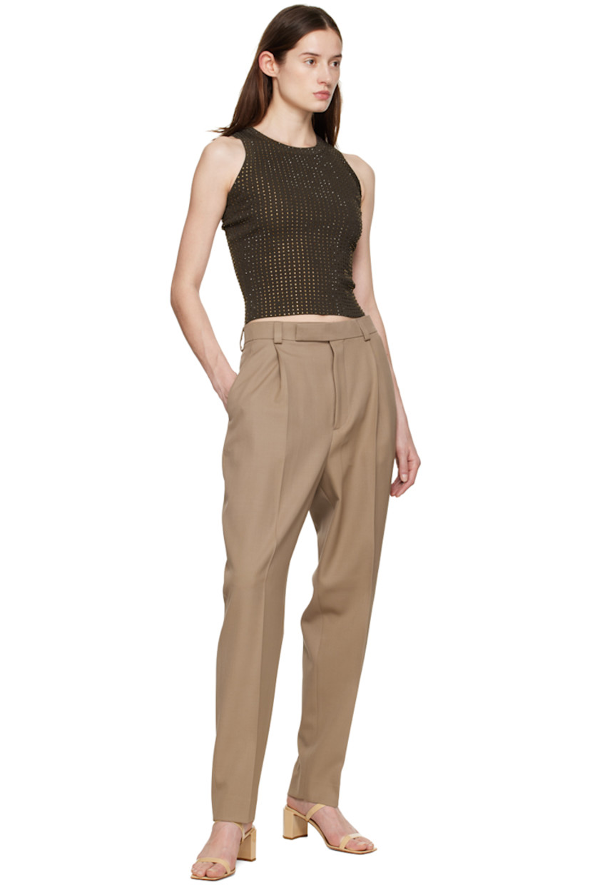 Wool gabardine trousers.

· High-rise
· Belt loops
· Three-pocket styling
· Zip-fly
· Twin pleats at front and back

Available exclusively at SSENSE.

Supplier color: Beige