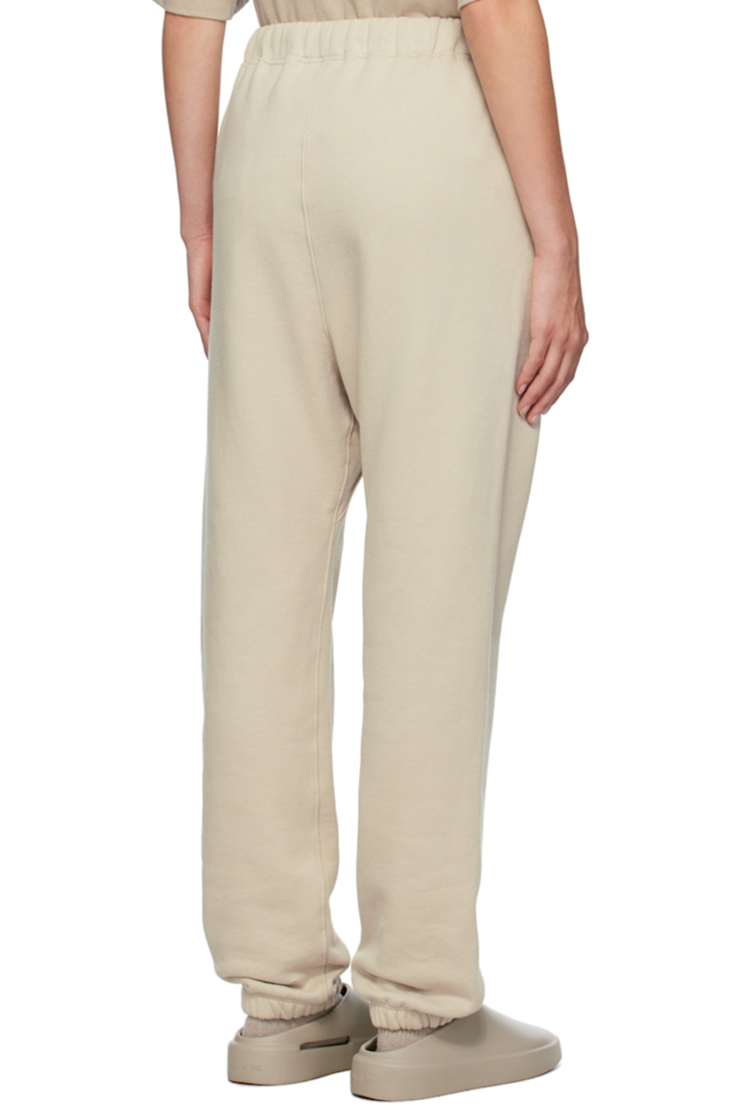 Straight-leg cotton fleece sweatpants.

· Drawstring at waistband
· Two-pocket styling
· Leather logo patch at front

Supplier color: Cement