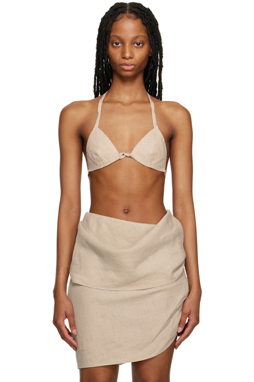 Plain-woven linen bralette. Raw edges throughout.

· Self-tie halter straps
· Self-tie fastening at back

Supplier color: Sand